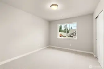 Second bedroom with 8' ceiling with a standard reach-in closet and prewired for internet.