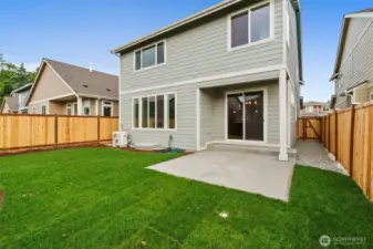 Backyard is landscaped and fully fenced with a patio.