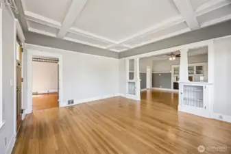Living Room peeking into the dining room and the 1st of 3 main floor bedrooms