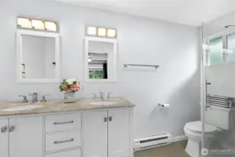 Large Primary Bathroom with Double sinks and walk in shower.
