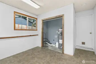 Large Utility Room with lots of room. Newer water heater.