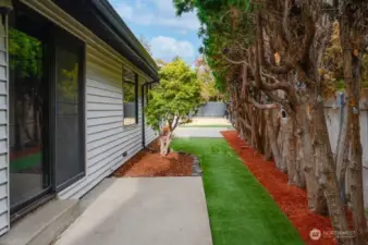 You can access the back yard from the family room or from the primary bedroom.