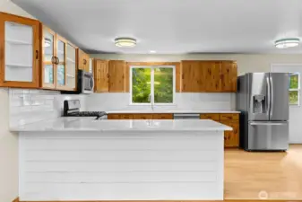 Kitchen was updated in 2023 with marble countertops, easy care laminate flooring and stainless appliances