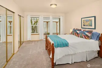 Primary Ensuite on Main Floor with 2 Double Closets and Access to Patio thru Slider