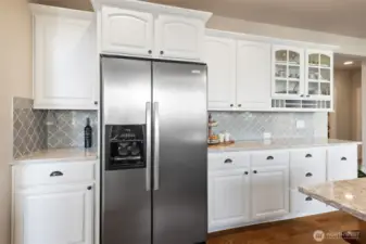 The kitchen layout supports both daily routines and special occasions with generous storage that is attractive, yet practical.