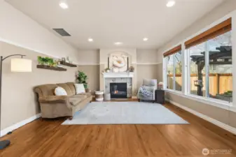 The family room centers around a cozy gas fireplace, creating a warm gathering space. Whether for quiet evenings or lively get-togethers, it’s a room that invites you to settle in. Comfort and style come together seamlessly here.