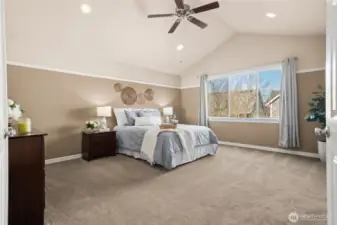 Upstairs the primary suite is a true retreat with vaulted ceilings and abundant natural light. The spacious design creates a peaceful, private escape. It’s a room that feels luxurious every day with soft, neutral carpet underfoot. A central vacuum system adds convenience throughout the home.