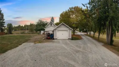 Detached 420 sgft garage with a huge covered space for storage.