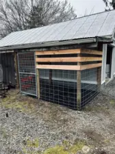 Enclosed dog kennel.
