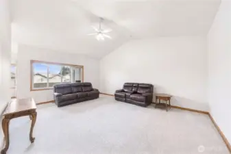 Open Living Area with Large Window and Flexible Layout - Virtually Decluttered