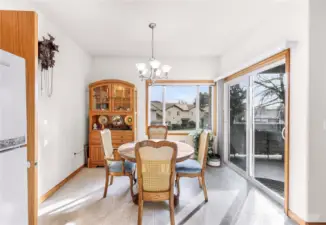 Dining Area with Large Windows and Access to Covered Patio