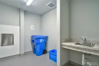 Each floor has two trash rooms with trash shoot and recycling bins. Handy sink too.