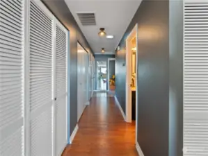 Hallway with wonderful storage closets.