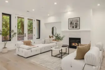 The lower-level flows perfectly with the main level both in style and quality of finishes. Notice the high ceilings and the great natural light.