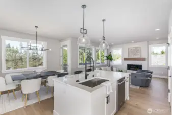 Gorgeous main floor with peaceful & rare territorial views of nature. Photo is of the staged model. Colors vary.