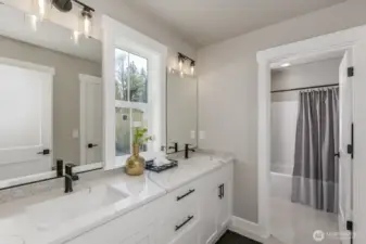 Upper hallway bath with large vanity & private shower room.Photo is of the staged model, the same 2,958 sf floor plan as the listed home.  Colors vary.