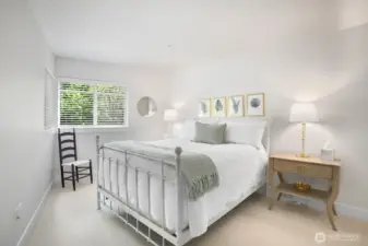 Comfortable Primary Bedroom with interesting angled walls and plenty of room.