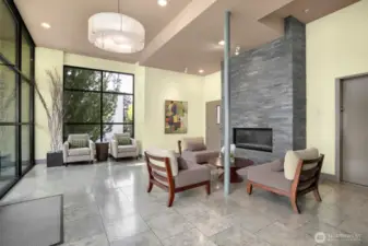 Secure lobby with fireplace. Elevator on the right. You can visit with friends and pick up your mail here.