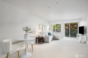 The great room with adjacent kitchen has lots of room to entertain guests.