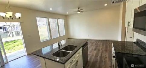 Looking into main living area. Lots of windows