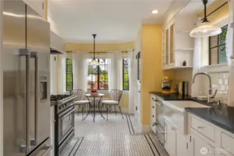 Updated kitchen with Cararra Marble basketweave flooring