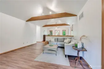 Living room.  Notice how the custom beams highlight the vaulted ceiling