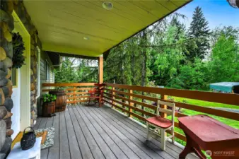 Covered front porch with easy care composite decking.