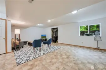 Family room downstairs has plenty of room for multiple entertainment options