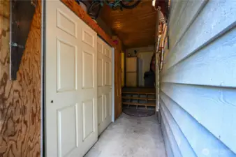 This breezeway between the house and garage has extra storage AND a half bath!  Perfect to clean up before coming in the house.