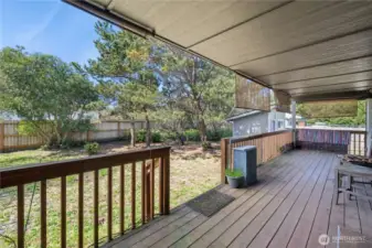 Back porch is the length of the home and is totally covered.