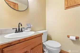 Freshly updated main floor half bath with stylish new fixtures.