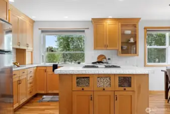 Looking at the kitchen with the large island with the gas range in it. The kitchen was updated a few years ago, and is very great.