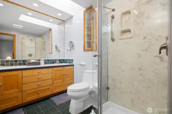 The primary bathroom was updated and has a large dual sink vanity and shower.