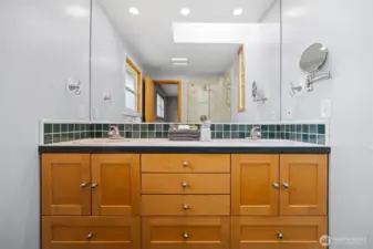 The dual vanity has so much storage in the shaker-style cabinetry.