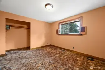 The second bedroom on the main floor looks out to the rear yard and is very spacious.