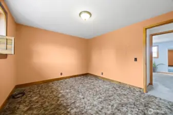 Looking at the bedroom across from the primary suite.