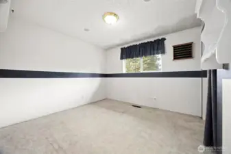 The third bedroom also looks out toward the rear yard and is very spacious.