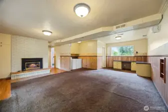 Looking across the family room toward the laundry room with the half bath beyond.