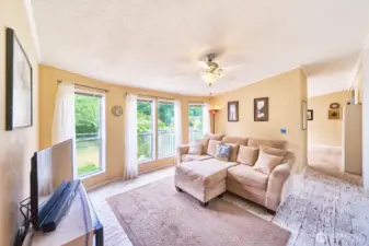 Adjacent great room also has large windows letting in lots of light.