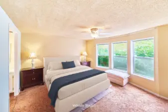 Primary bedroom looking out to garden - Virtually Staged