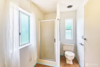 Primary bathroom has stand-up shower and a soaking tub.