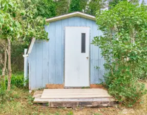 Shed for storing yard equipment and gear.