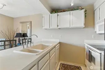 Kitchen offers a breakfast bar for two.