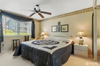 Primary bedroom is spacious, large closet and ceiling fan.