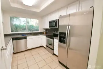 Kitchen featuring Corian counters
