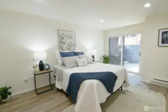 Primary bedroom with sliding doors to access your private patio