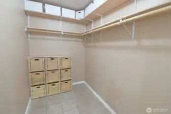Primary Bedroom walk in closet with ample storage options.