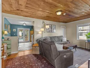 As you enter the home, you're warmly greeted by the beautiful cedar lined ceilings in the living room.