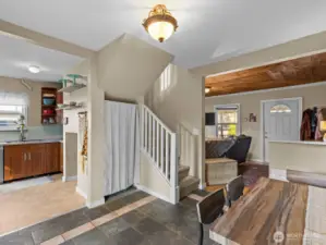 Little nooks under the stairwell create additional storage space.