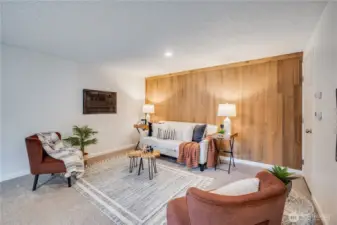 The original, wood lined wall provides a warm accent in this flexible space.